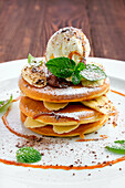 American pancakes with ice cream, banana and nut butter