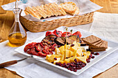 Antipasti platter with cheese and vegetables