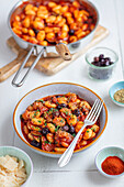 Gnocchi with tomato sauce, zucchini and olives