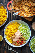 Pulled chicken with curry rice and salad