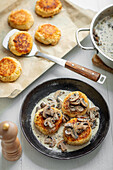 Potato and quark cakes with mushroom cream sauce