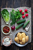 Ingredients for baked potatoes with cream cheese and herbs