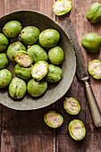 Green walnuts, partly halved, for walnut liqueur