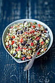 Pasta salad with feta, cucumber, peppers and cranberries