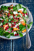 Papaya and mozzarella salad with pomegranate seeds