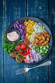 Turkey gyros bowl with vegetables and dip