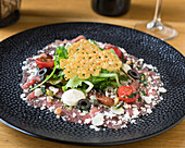 Carpaccio with rocket and parmesan