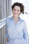 Young woman in light-blue shirt dress