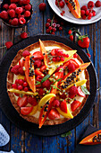 Fruit tart with papaya and summer berries