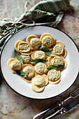 Ricotta and spinach ravioli with sage leaves