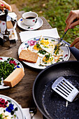 Fried eggs with fresh herbs and bread