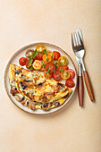 Mushroom omelette with cherry tomato salad