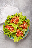 Lettuce wraps filled with minced meat and peanuts