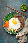 Bibimbap with beef, vegetables and fried egg