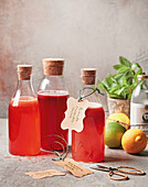 Three kinds of summer fruit syrup made from raspberries, passion fruit and tomatoes