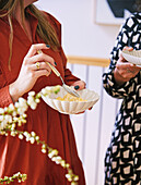 Women eating vanilla ice cream