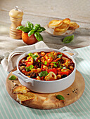 Mediterranean vegetable stew with artichoke hearts, olives and white beans