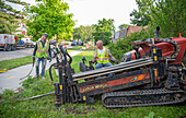 Workers replacing lead water pipes