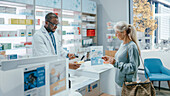 Female customer paying at pharmacy checkout