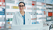 Pharmacist behind pharmacy counter