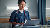 Healthcare professional using laptop