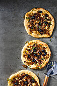 Pizza with anchovies, caramelised onions and thyme honey