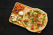 Focaccia with tomatoes, rocket, cheese and sweet potato fries