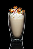 Coffee cocktail with cream and caramelised popcorn