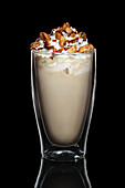 Iced coffee with cream and nut topping