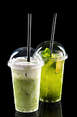 Iced matcha latte and lime and mint drink