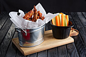 Chicken wings with carrot and celery sticks