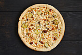 Pizza with chicken, honey mushrooms and gherkins