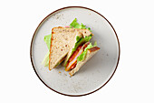 Club sandwich with ham, lettuce, tomatoes and cheese