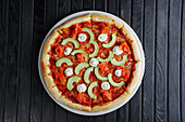 Pizza with salmon, avocado and feta cheese