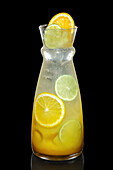 Tangy lemon-lemonade cocktail with orange and lime slices