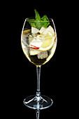 Apple cocktail with sparkling wine and mint