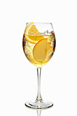 Summery apple-orange cocktail with ice cubes
