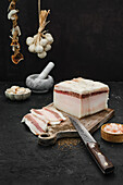 Pork lardo with garlic and spices