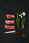 Raw beef ribs with garlic and herbs
