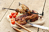 Grilled ribs and mushrooms on skewers