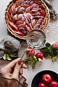 Red apple cake with icing sugar