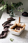 Pour chocolate ganache into baking tin