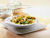 Chicken and vegetable curry with rice and cashew nuts