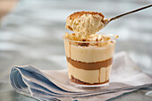 Tiramisu with hazelnut cream in a jar