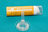 Medical adhesive remover spray with urinary sheath