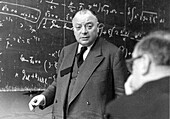 Wolfgang Pauli in front of blackboard