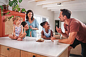 Parents with children in kitchen