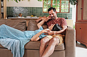 Couple relaxing on sofa