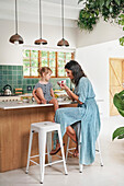 Mother with daughter in kitchen