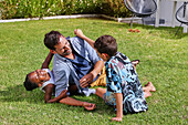 Father with children playing in backyard